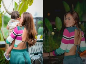 Kenakan baju rajut dengan punggung terbuka saat menggendeong seorang bayi, Wulan Guritno disebut sebagai hot mom.