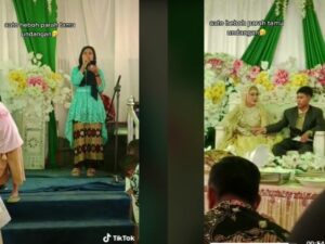 Seorang wanita nyanyi nikahan mantan kekasihnya, buat mempelai wanita sampai nangis serta disoraki tamu undangan.
