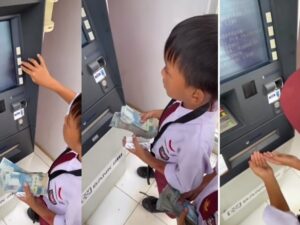 Viral video yang mempelihatkan dua orang anak berseragam Sekolah Dasar (SD) tengah mengambil segepok uang jutaan rupiah di ATM.