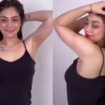 Celine Evangelista mencuri perhatian publik karena mengenakan tanktop hitam yang memperlihatkan gambar tato di dadanya bertuliskan sesuatu.