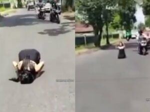 Cekricek.id, Berita Viral – Seorang wanita yang hanya dibalut kemben dari kain hitam sukses mencuri perhatian karena aksi nekatnya. Tanpa menghiraukan orang lain, dia memeragakan gerakan salat di tengah jalanan aspal sambil ditemani kendaraan yang berlalu-lalang.