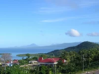 Pemandangan Kota Sofifi di pesisir Halmahera dengan laut dan pulau di kejauhan