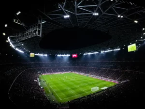 Ilustrasi suasana stadion sepak bola pada malam hari