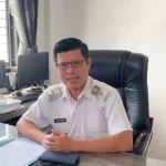 Kepala Dinas Kominfo Kota Pariaman Yalviendri di ruang kerjanya