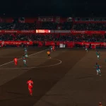 Laga sepak bola berlangsung di stadion penuh penonton
