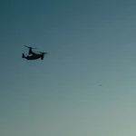Puing bangunan dengan api yang masih menyala di lokasi serangan drone di Kryvyi Rih, Ukraina.
