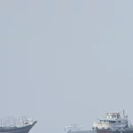 Kapal-kapal komersial terlihat di dekat Selat Hormuz dari Musandam, Oman