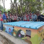 Mahasiswa KKN Institut Teknologi Bandung berdiri di dekat reservoir air bersih yang dibangun di Desa Talagasari.