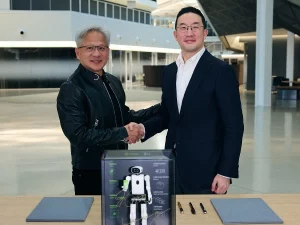 Jensen Huang dan Kwang Mo Koo berjabat tangan di markas Nvidia, Santa Clara