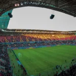 Lapangan dan tribun stadion sepak bola