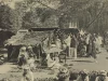 Foto hitam putih pasar Payakumbuh sekitar 1910 dengan los beratap rumbia, pedagang duduk beralas tikar, dan keranjang hasil bumi di tanah