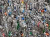 Tumpukan botol plastik PET bekas yang sudah dipadatkan menjadi bal.