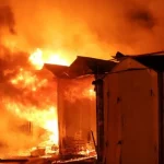 Api membakar deretan garasi di distrik Holosiivskyi, Kyiv, setelah serangan rudal Rusia
