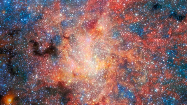 Citra medan IRS 3 hasil gabungan instrumen NIRCam dan MIRI James Webb Space Telescope di sekitar lubang hitam Sagitarius A*.
