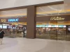 Pengunjung berjalan di depan lobi bioskop di pusat perbelanjaan Living World Kota Wisata, Bogor.