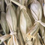 Dodol Gorontalo terbungkus daun nipah muda yang diikat pada bagian ujungnya