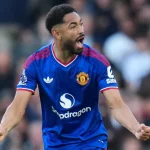 Matheus Cunha merayakan gol penyeimbang Manchester United ke gawang Fulham