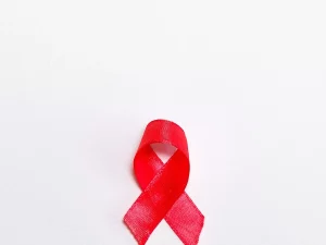 Ilustrasi pita merah sebagai lambang kepedulian terhadap HIV dan AIDS