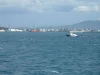 Deretan tangki, cerobong, dan dermaga kawasan industri pesisir Cilegon dilihat dari laut