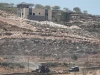 Kendaraan militer Israel beroperasi di dekat rumah warga Palestina di Desa Qusra, Tepi Barat