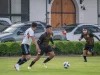 Pemain berebut bola dalam pertandingan sepak bola