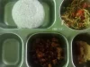 Ompreng baja berisi nasi, mi bersayur, lauk, dan gorengan dari program Makan Bergizi Gratis