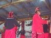 Penari adat Pamona berbusana merah membawakan tarian di atas panggung festival