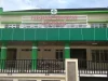 Gedung Puskesmas Pegambiran Kota Padang berdinding hijau dengan pagar besi di depannya