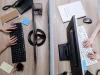Dua pekerja mengetik di papan ketik komputer pada meja kantor bersekat