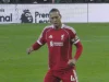 Virgil van Dijk berlari mengenakan seragam merah Liverpool