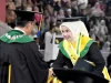 Seorang wisudawati menerima ijazah pada prosesi wisuda Universitas Jenderal Soedirman di Purwokerto