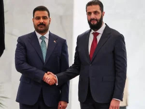 Presiden Suriah Ahmed al-Sharaa berjabat tangan dengan PM Irak Ali al-Zaidi