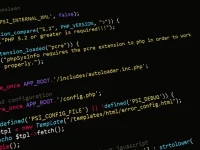 Potongan kode pemrograman PHP berwarna di layar monitor berlatar gelap
