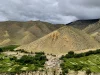 Desa Ghyakar di antara ladang berteras dan perbukitan gersang di Upper Mustang, Nepal
