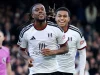Alex Iwobi tersenyum merayakan gol Fulham ke gawang Hull City di Craven Cottage