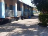 Ilustrasi deretan ruang kelas dan halaman St Marys Secondary School di Lusaka, Zambia