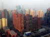 Ilustrasi gedung-gedung bertingkat diselimuti kabut asap di kawasan Dawang Lu, Beijing, Desember 2014