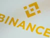Logo bursa kripto Binance berwarna kuning tampil di layar ponsel