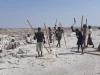 Para pekerja Afar mencungkil dan menumpuk balok garam di dataran garam wilayah Afar, Etiopia