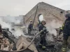 Petugas pemadam kebakaran bekerja di reruntuhan gedung kantor akibat serangan drone Rusia di Kharkiv