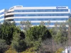 Gedung kantor pusat Qualcomm dengan logo perusahaan di San Diego, Amerika Serikat